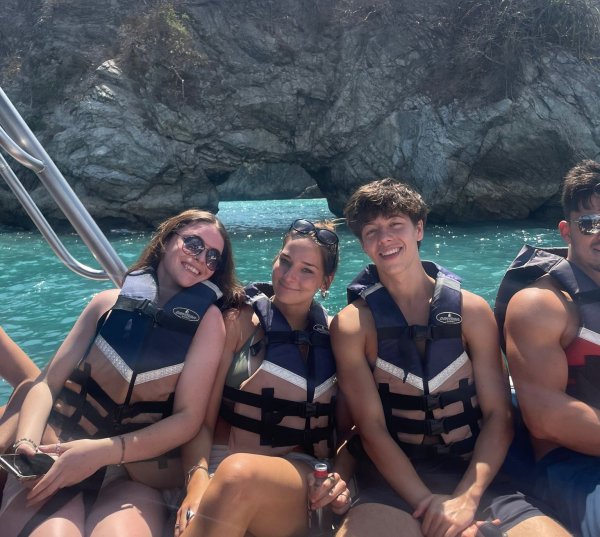 Costa Rica Leapers learning to surf on beach.